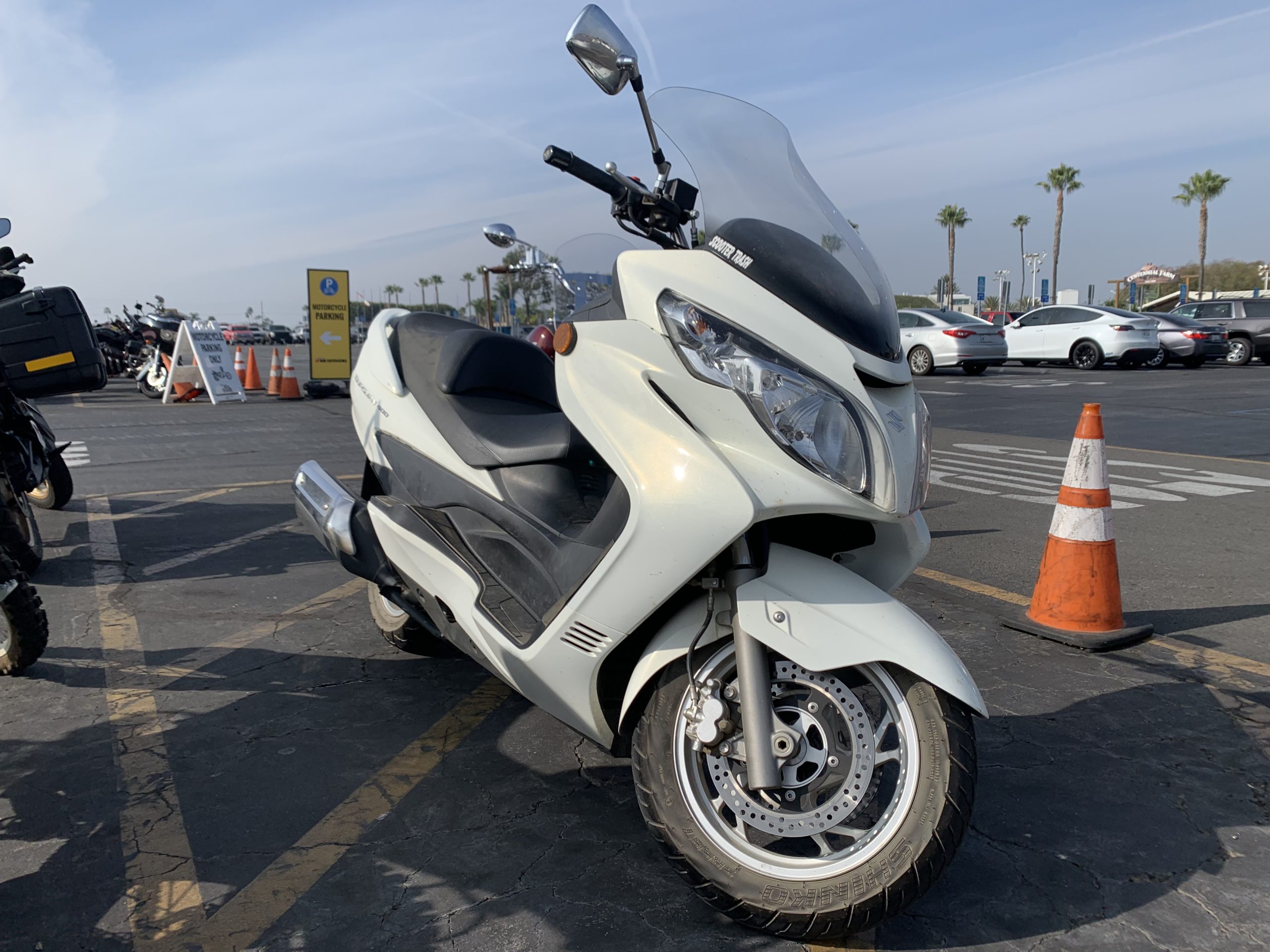 Beige scooter parked outdoors for IMS 2021