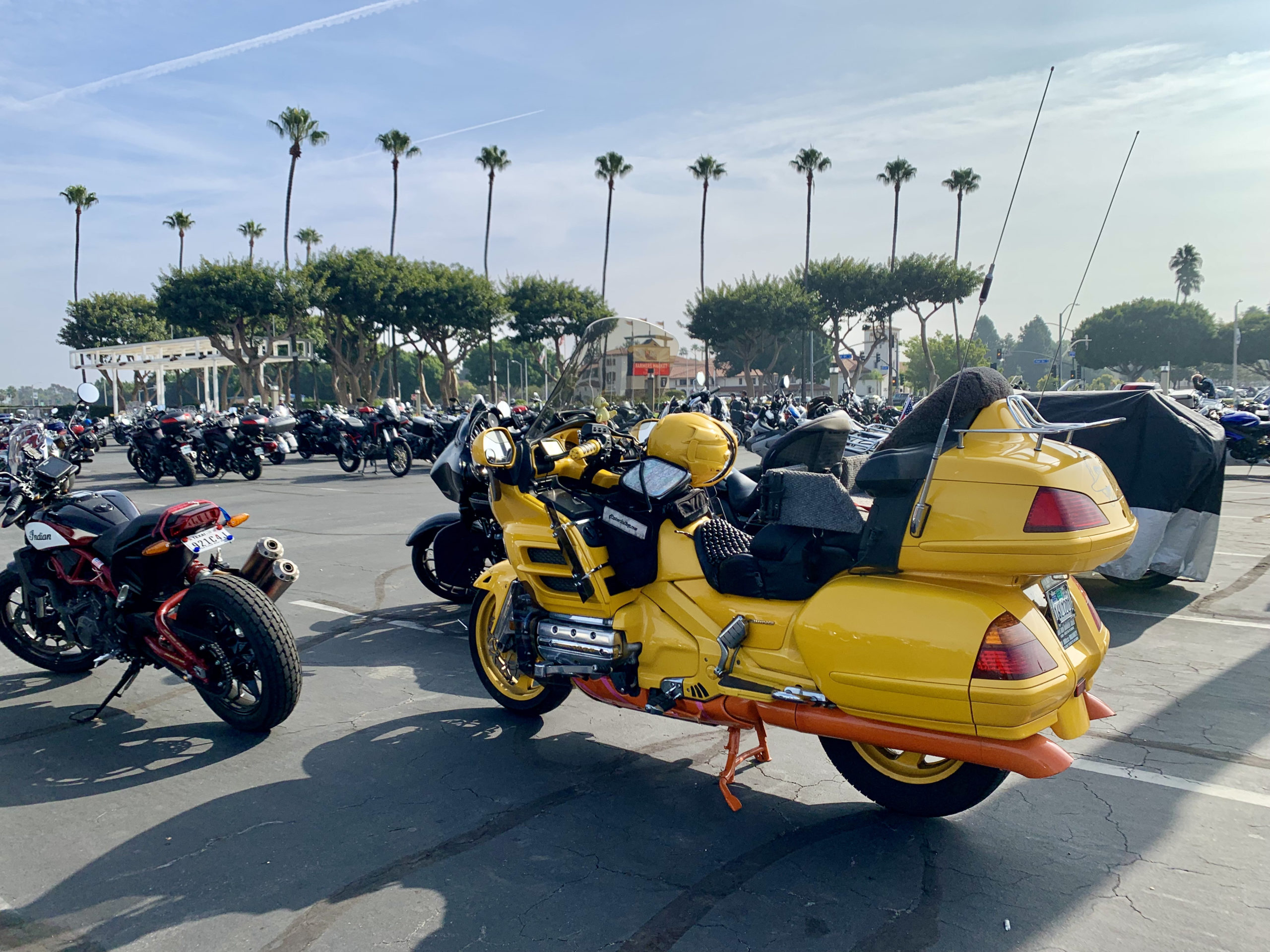 Bright yellow cruiser motorcycle parked outdoors for IMS 2021