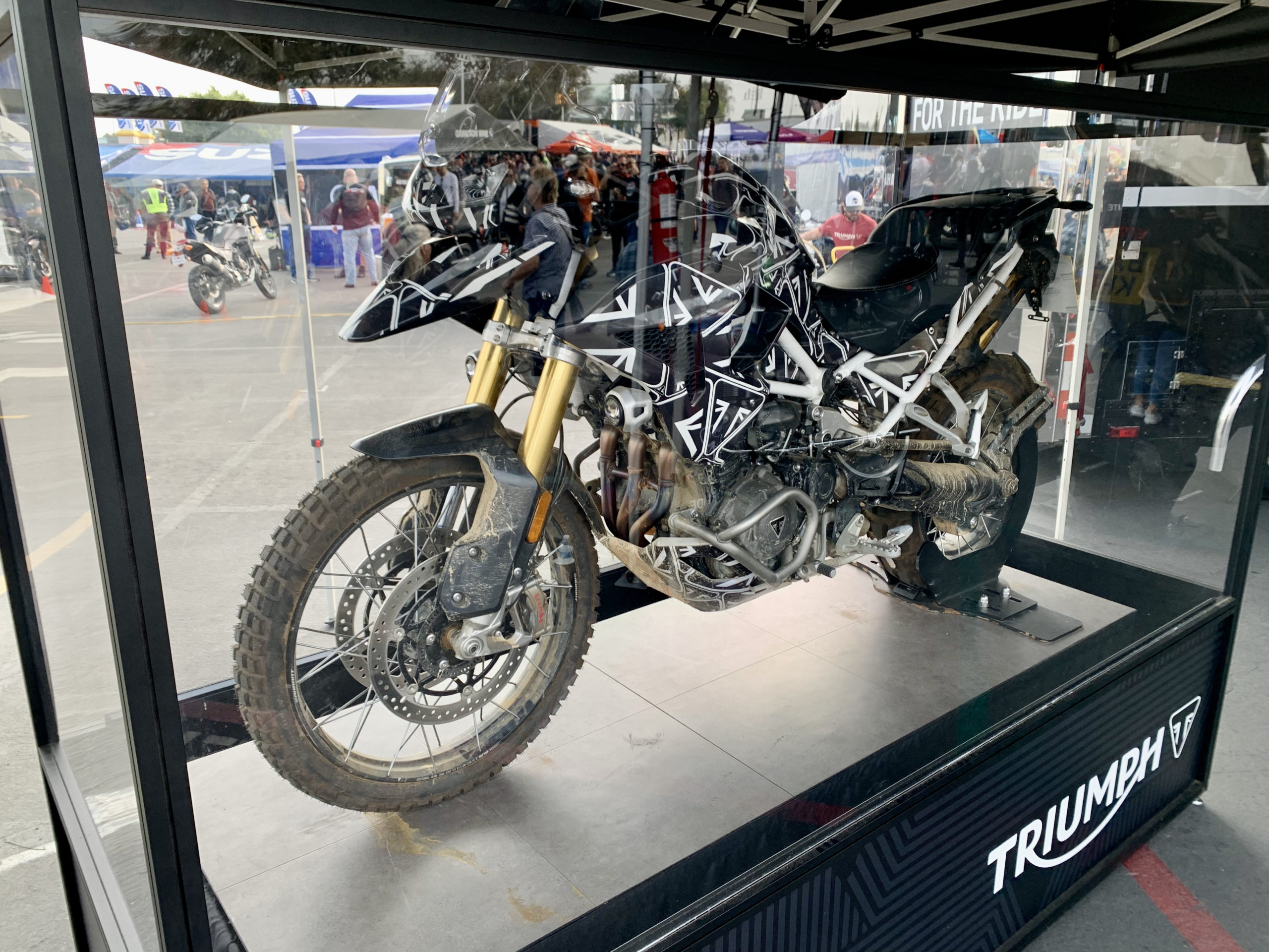 Triumph Tiger 1200 in glass case at IMS Outdoors 2021